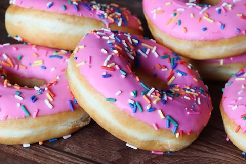 Close-up of pink sprinkle doughnuts