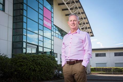 A man in a pink shirt outside Macphie's Tannochside factory