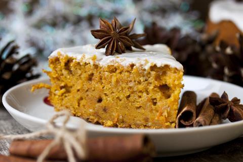 A spiced pumpkin cake in a bowl with a star anise on top