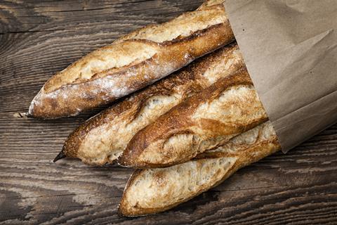 Rustic baguettes in a paper bag