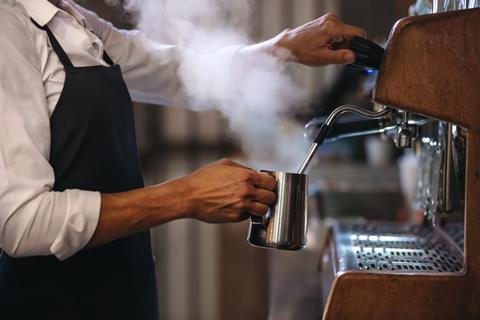 Barista using coffee machine