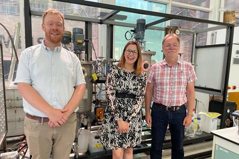 L-R KTP associate Liam Morris, Puratos bakery R&D manager Céline Laigle, and Professor Grant Campbell in front of the bioethanol plant in the Chemical Engineering lab at the University of Huddersfield