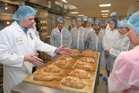 Jones Village Bakery academy manager Phil Martin is impressed by the baking skills of the visitors.