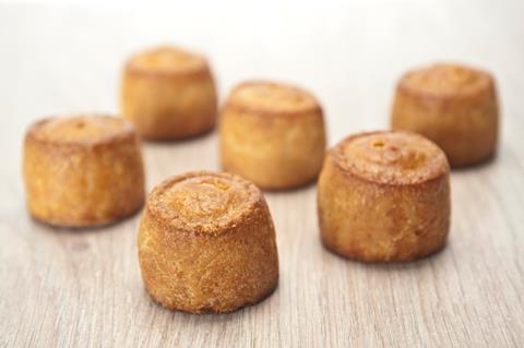 Mini pork pies on a wooden board