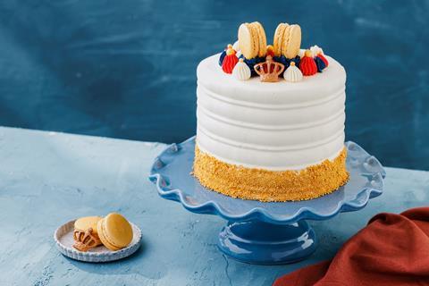 Patisserie Valerie jubilee cake with white frosting and red, white and blue decorations on top