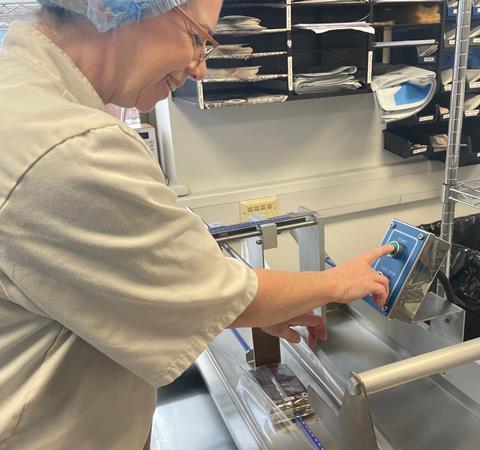 The Homemade Brownie Company - Staff member operates a new packaging machine
