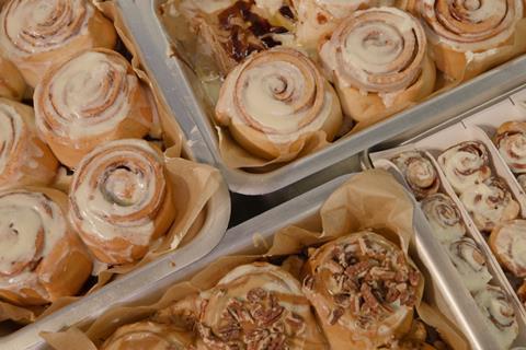 A selection of Cinnabon's treats on silver trays