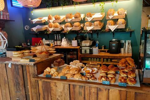 Inside a bakery with fresh loaves on display