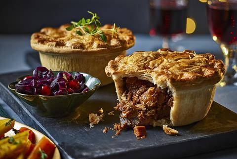 Two no beef pies on a slate with red cabbage