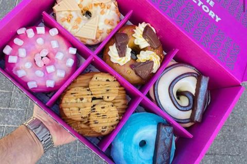 Project D doughnuts in a bright pink box