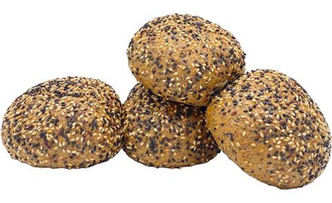Four seeded rolls on a white background