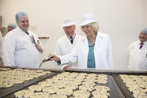 Charles and Camilla flipping Welsh cakes at Village Bakery