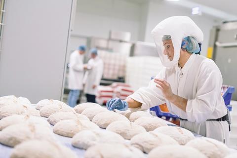 A worker in PPE on the Nicholas & Harris sourdough line