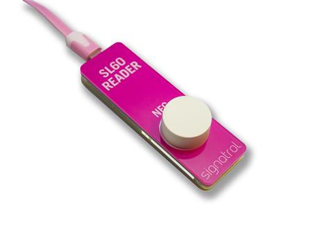Signatrol - SL63T temperature data logger plugged into an SL60 reader