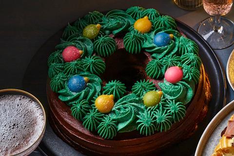 A chocolate cake decorated to look like a wreath