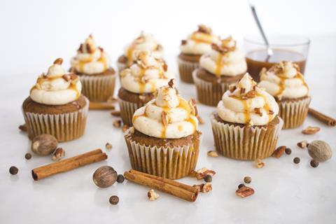 A selection of pumpkin spice flavour cupcakes with caramel and cinnamon
