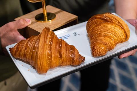 A close up of two croissants on a tray