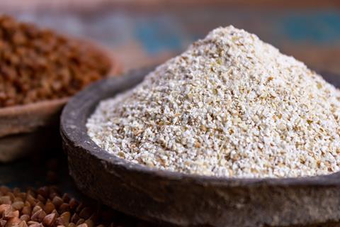 Buckwheat flour in a wooden bowl