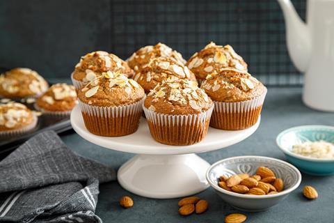 Oat topped muffins on a white cake stand