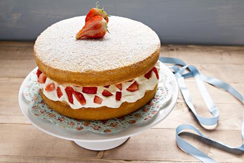 A Victoria sponge cake with a strawberry on top