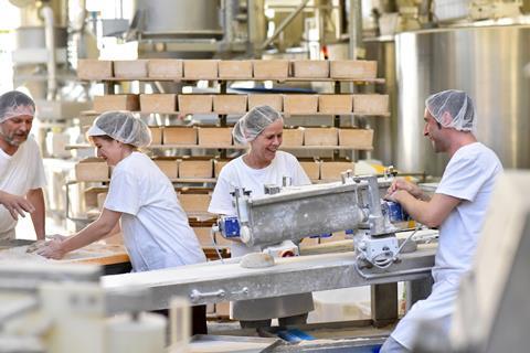 Workers on industrial bakery line