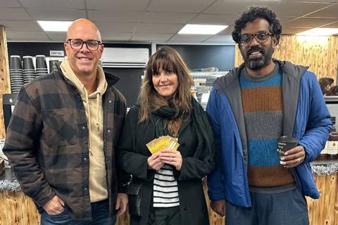 Romesh Ranganathan (right) stands with Coughlans Bakery director Sean Coughlan and raffle prize winner Kerrie at the Maidenbower shop in Crawley  - Coughlans Bakery  2100x1400