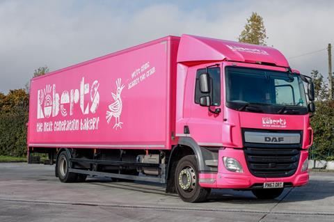 A pink lorry with Roberts Bakery branding on it