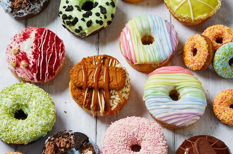 Colourful doughnuts on a wooden background