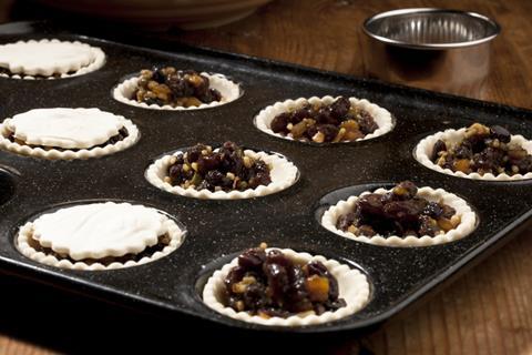 Mince pies in a muffin tray before being put in the oven