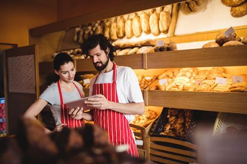 Bakers looking at a tablet