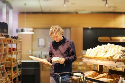 Student considers bread purchases at a supermarket