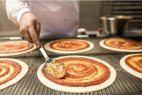 Crust &Crumb pizzas being decorated