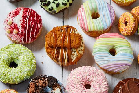 Colourful doughnuts on a wooden background