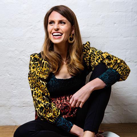 Ellie Taylor in a bright coloured leopard print top