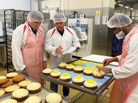 Staff prepare and check special edition Marie Curie cakes at Clayton Park Bakery