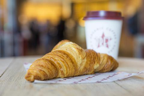 A French Butter Croissant with a takeaway cup of coffee at Pret.