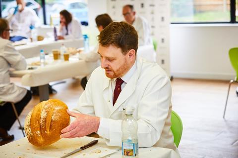 John Lognonné from Davidson of Darras Hall assess a loaf's appearance