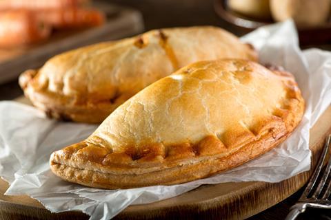 Two Cornish pasties on baking paper