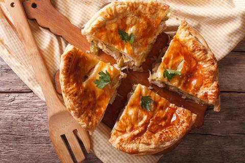 Large chicken pie cut into four