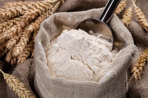 White flour in bag with wheat