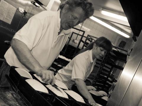 David Robinson and daughter Grace prepare dough for baking  911x681