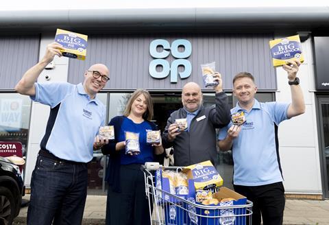 Brownings the Bakers and Co-op staff smile outside a store with a trolley full of pies