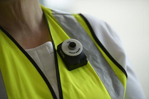 The Arosa Instruments monitor on a bakery worker's lapel