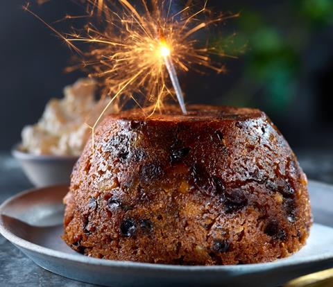 A clootie pudding with sparkler in the top