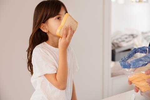 8 Girl smelling bread