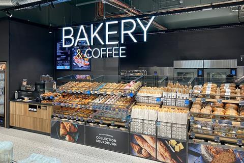 M&S Bakery & Coffee  sign above a well-stocked in-store bakery