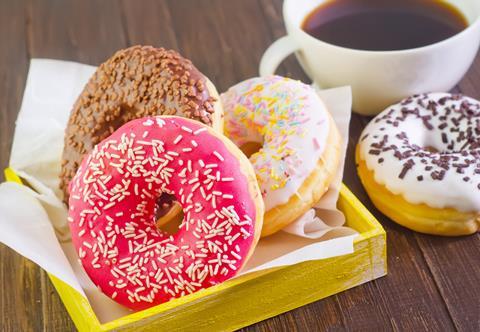 Doughnuts with pink icing and sprinkles