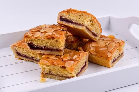 A pile of Bakewell Slices on a white wooden tray