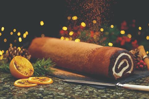 A chocolate roll on a festive background