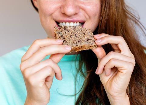 Person-Eating-Wholemeal-Bread-With-Seeds-01 RS 2